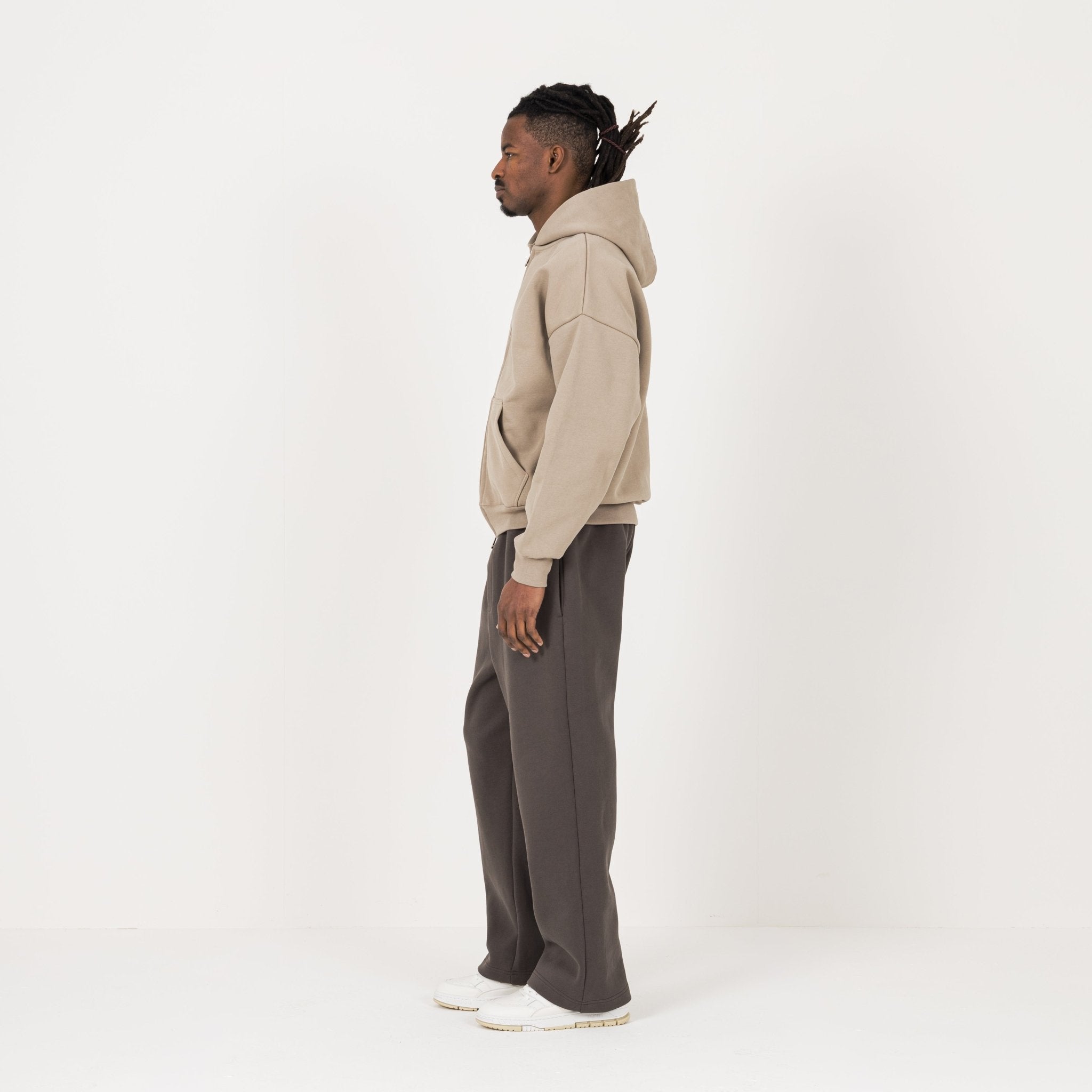 Model Side view of Destructive Sculpt Zip Loam Brown Hoodie